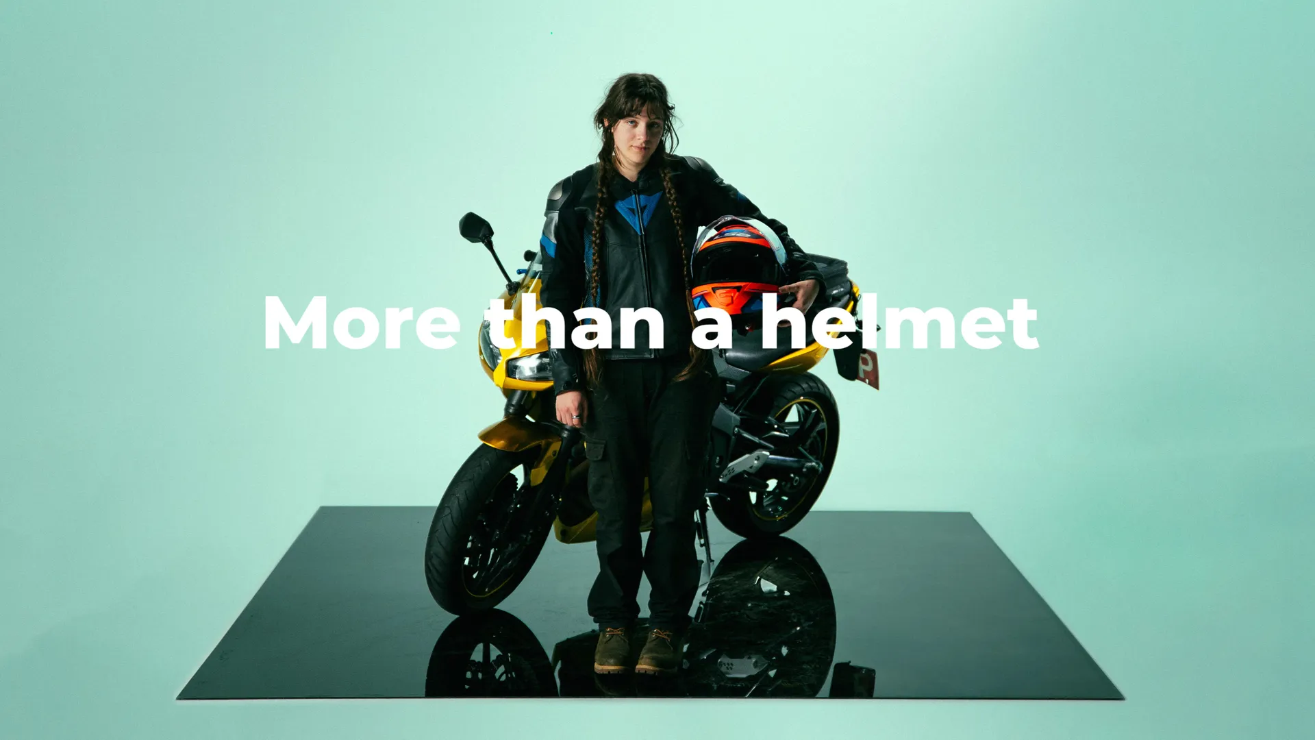 A motorcycle rider with the text 
